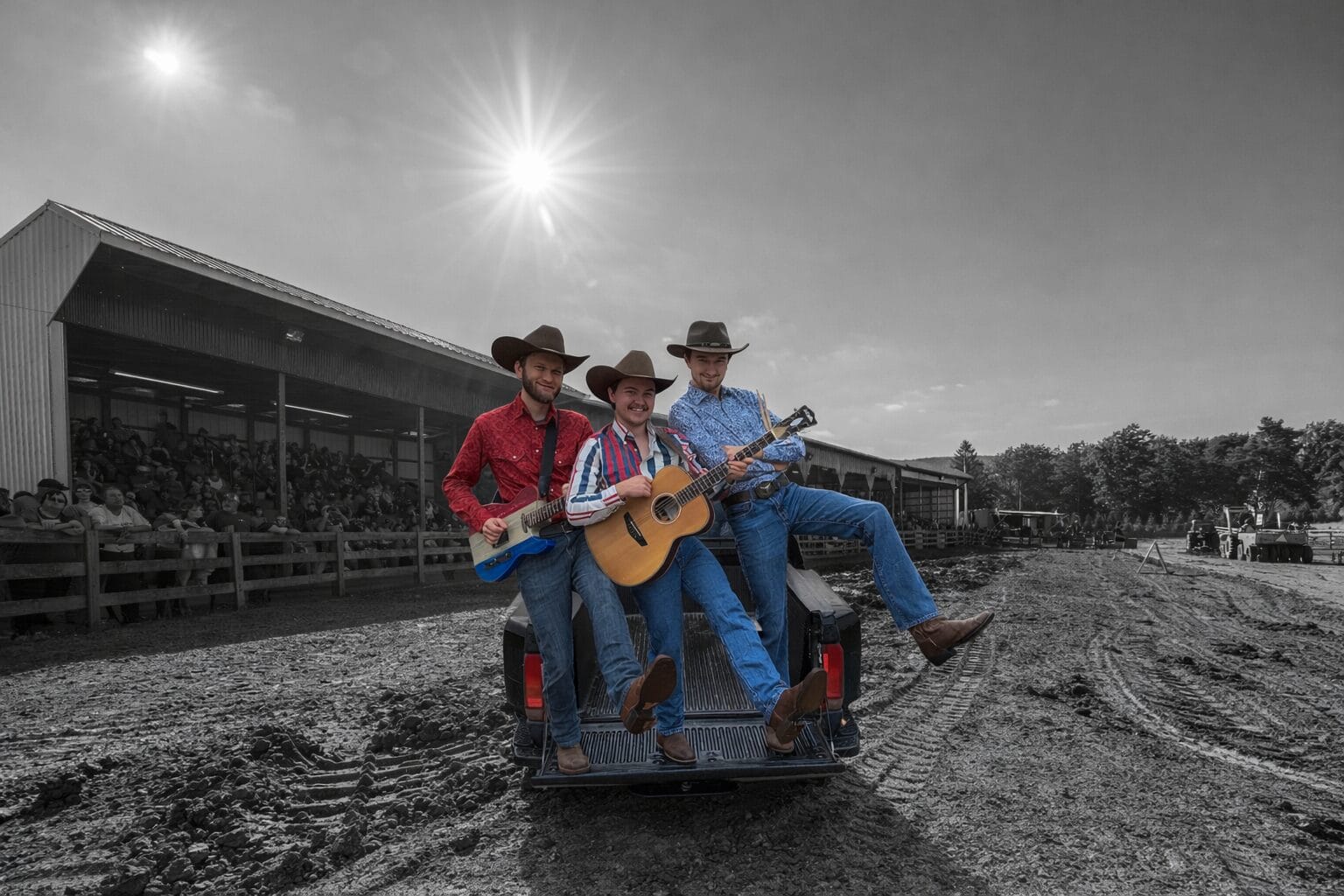 High Carbon Steel band members playing guitars on pickup tailgate